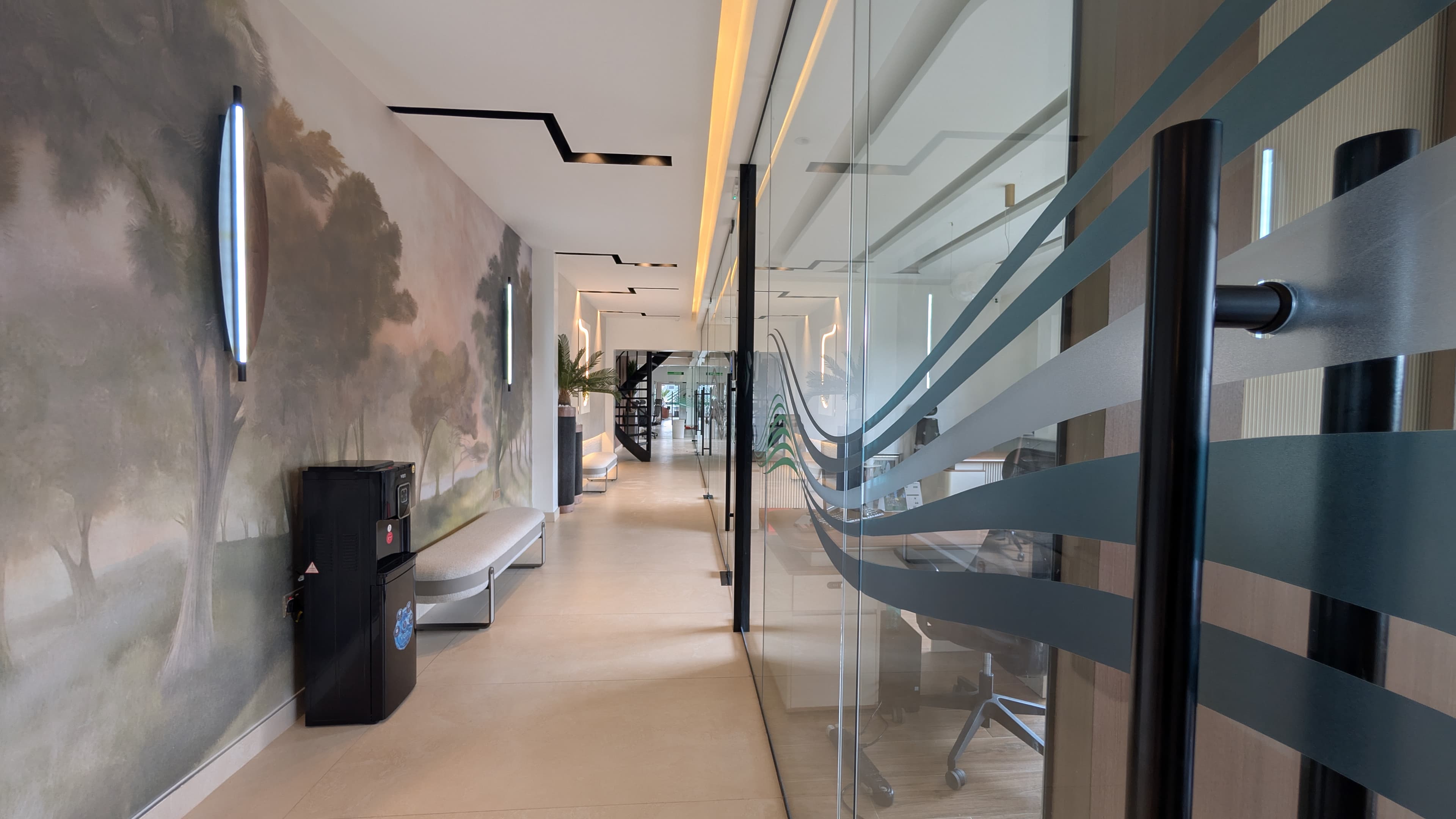 Corridor — charcoal carpet tiles and matte black window frames